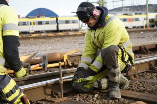 two men at work on tracks